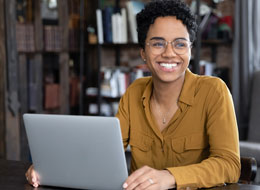 Employee talking in front of laptop