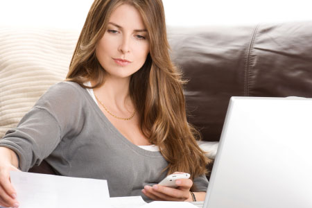 woman paying bills at computer
